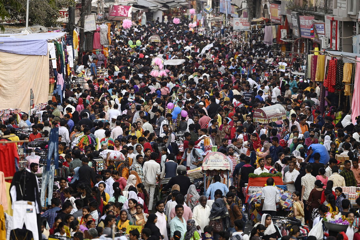 <i>Deepak Gupta/Hindustan Times/Getty Images</i><br/>A crowd of shoppers gathers at a market on March 2