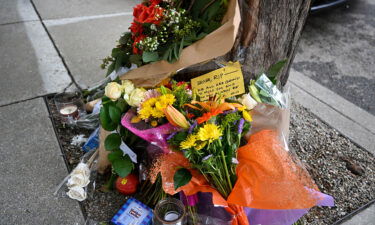 Flowers and cards left as people paying tribute to Bob Lee near the Portside apartment building in San Francisco.