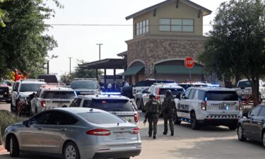 Emergency personnel work the scene of a shooting at Allen Premium Outlets on May 6