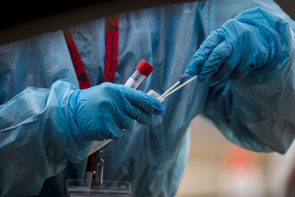 <i>Chet Strange/Bloomberg/Getty Images</i><br/>A healthcare worker prepares a Covid-19 swab test in Longmont