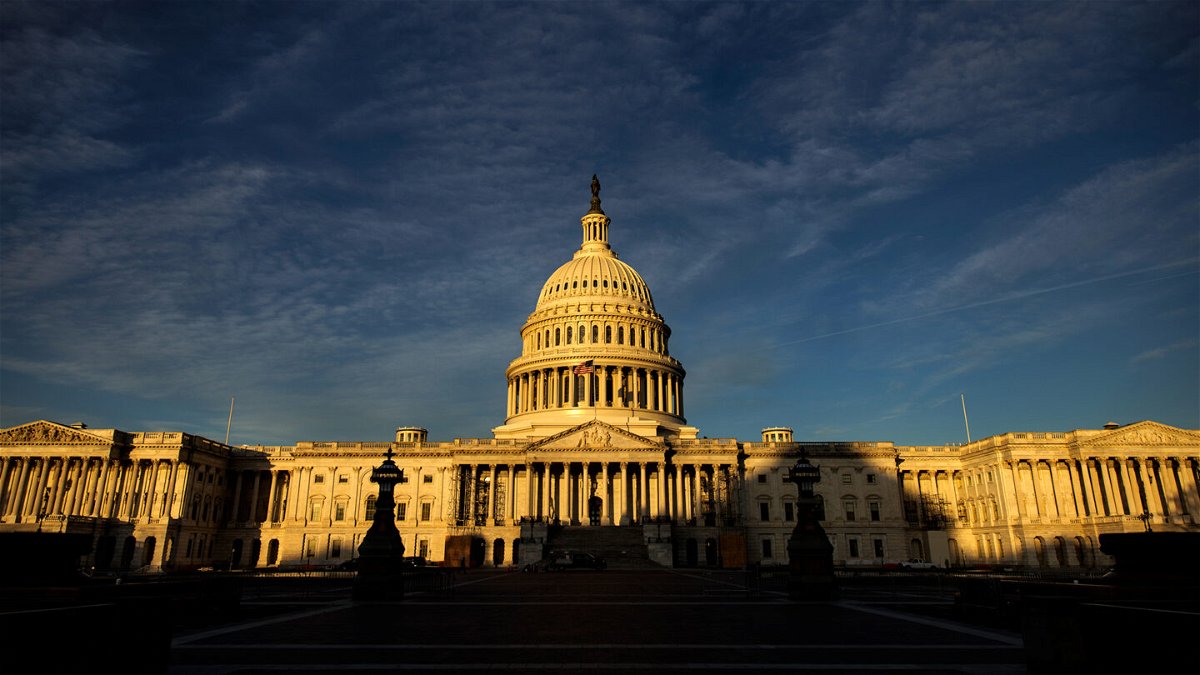 <i>Samuel Corum/Getty Images</i><br/>The rising sun creeps across the US Capitol dome in November 2022 in Washington