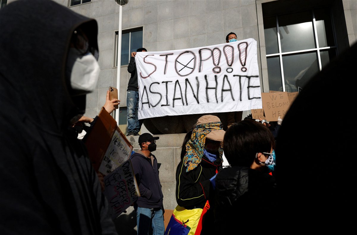<i>Justin Sullivan/Getty Images/File</i><br/>Protesters hold a sign during a rally in solidarity with Asian hate crime victims outside of the San Francisco Hall of Justice in 2021.