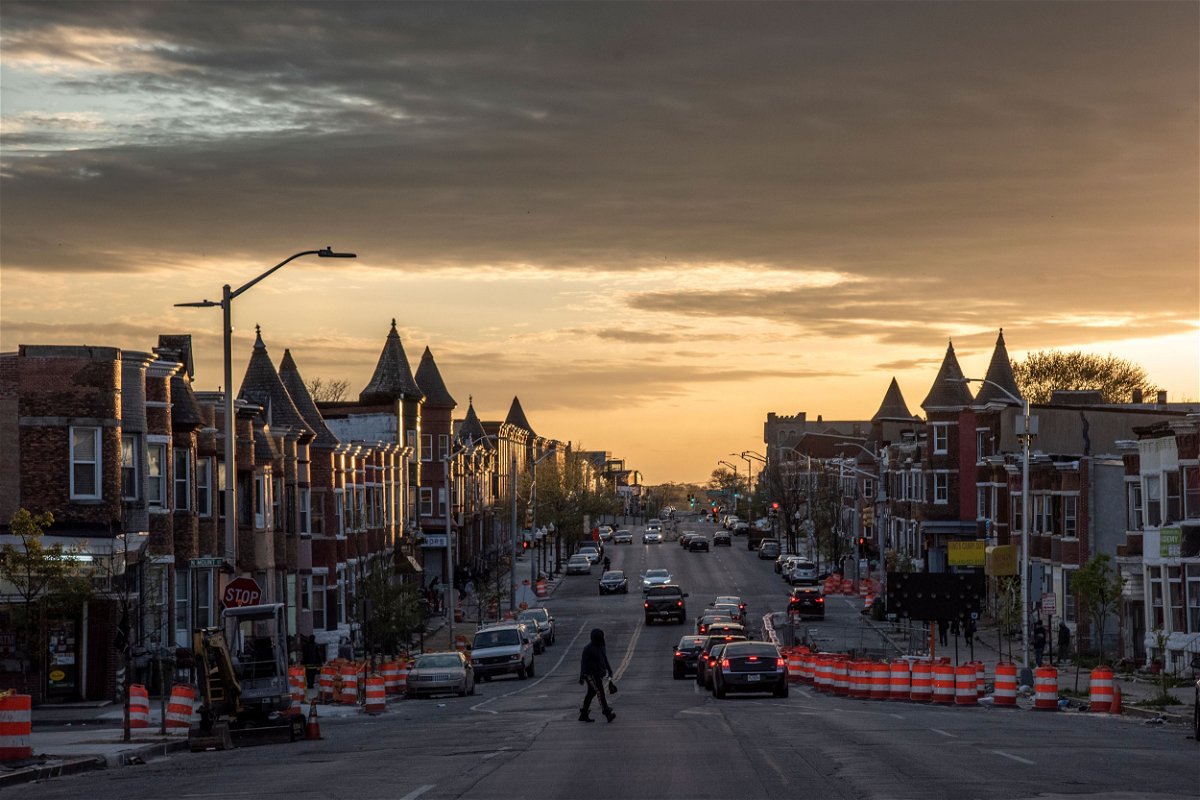 <i>Jahi Chikwendiu/The Washington Post/Getty Images</i><br/>The sun sets over W. North Avenue near where Freddie Gray lived in Baltimore on April 19