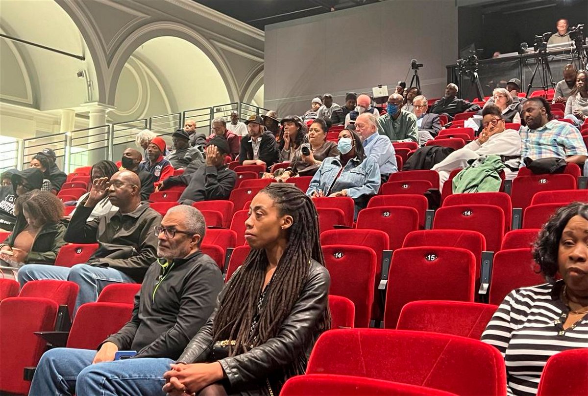 <i>Sophie Austin/AP</i><br/>People in Oakland listen to the reparations task force