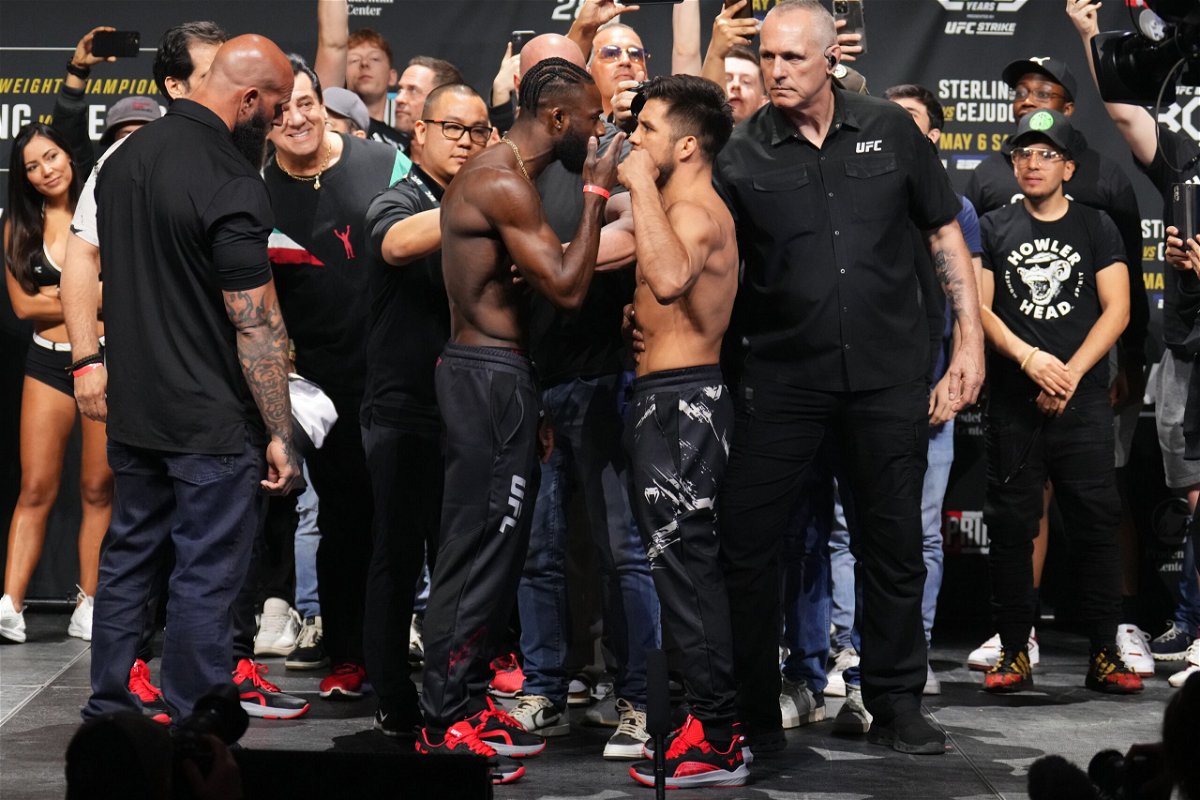 <i>Chris Unger/Zuffa LLC/Getty Images</i><br/>Aljamain Sterling (left) and Henry Cejudo face off during the UFC 288 ceremonial weigh-in on May 5.