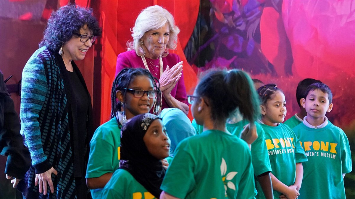 <i>Timothy A. Clary/AFP/Getty Images</i><br/>First lady Jill Biden and US Supreme Court Justice Sonia Sotomayor pose with children from PS 55 at the Bronx Children's Museum in New York on May 3.