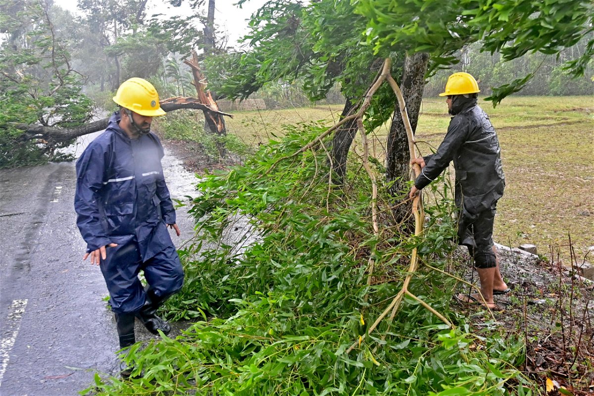 <i>Munir Uz Zaman/AFP/Getty Images</i><br/>Rescue team remove fallen trees to clear a road in Teknaf.