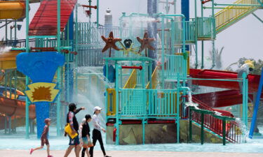 Visitors cool off at an amusement park in Hoi An