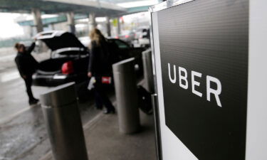 Uber's revenue for the quarter ending in March climbed 29%. Pictured is a pickup point for the Uber car service at LaGuardia Airport in New York.