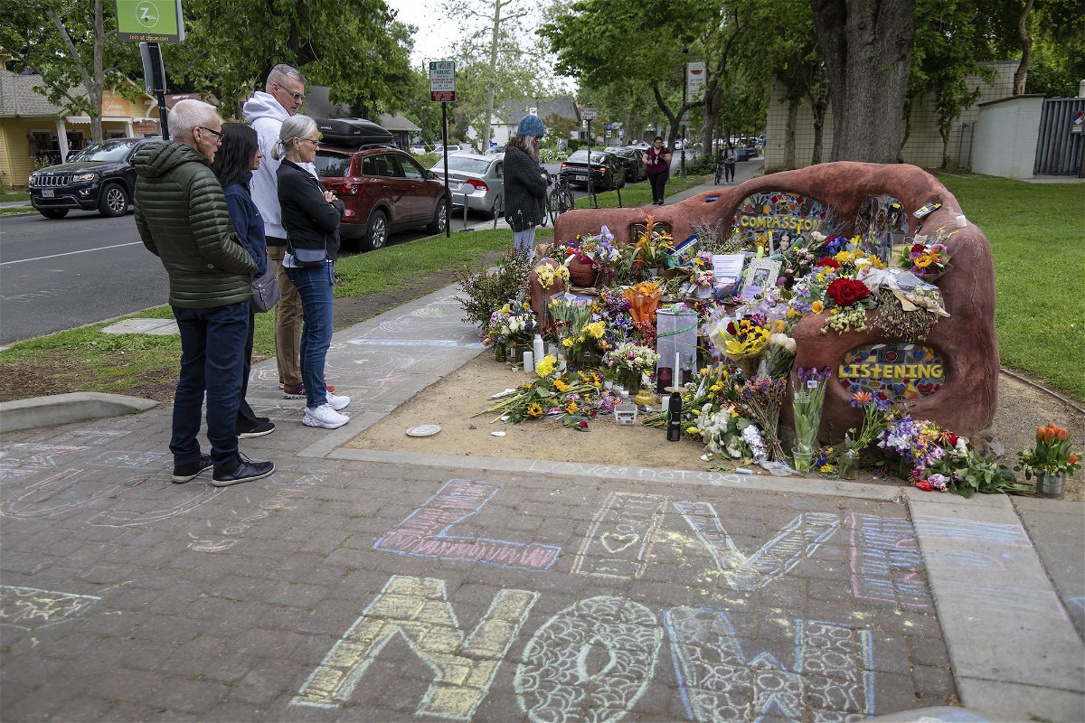 <i>Paul Kitagaki Jr./The Sacramento Bee/AP</i><br/>People view a memorial set up in Davis