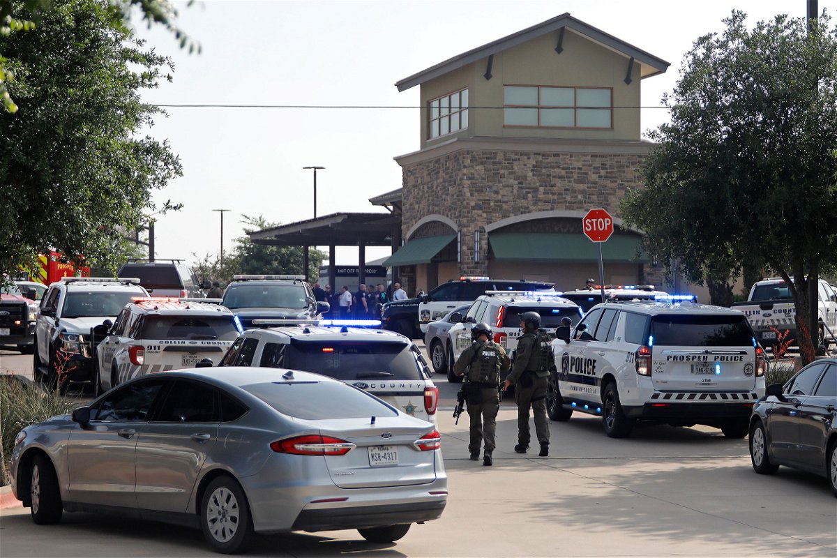 <i>Stewart  F. House/Getty Images</i><br/>Emergency personnel work the scene of a shooting at Allen Premium Outlets.