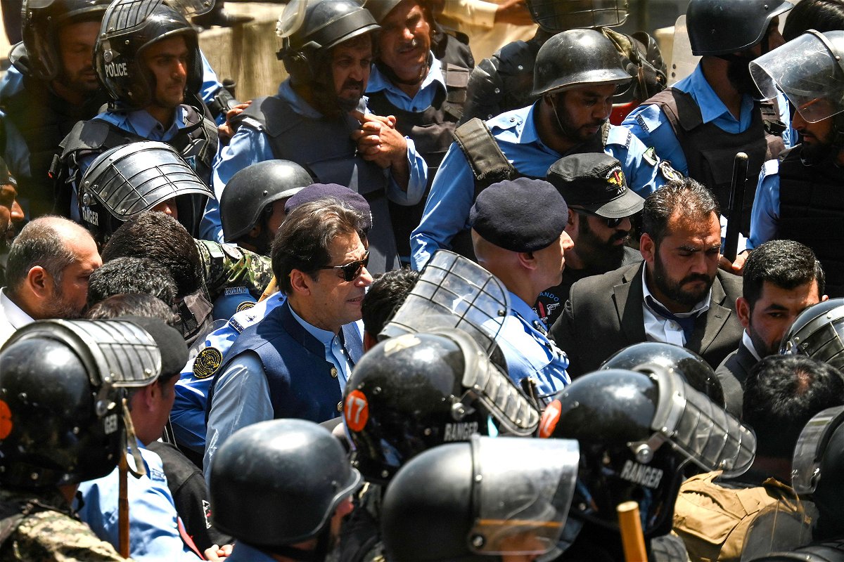 <i>Aamir Qureshi/AFP/Getty Images</i><br/>Policemen escort Pakistan's former prime minister
