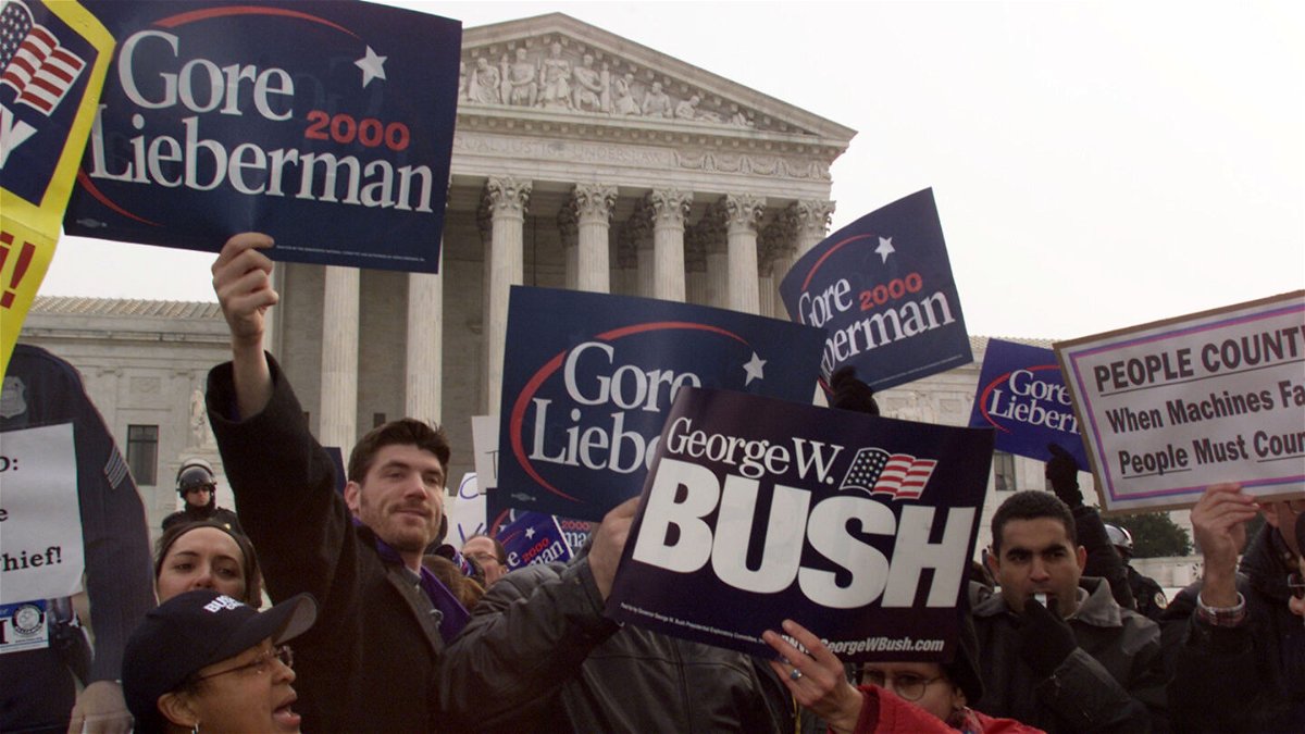 <i>Mark Wilson/Newsmakers/Getty Images</i><br/>Bush and Gore supporters are pictured here arguing their point to each other in front of the U.S. Supreme Court building in December 2000 in Washington
