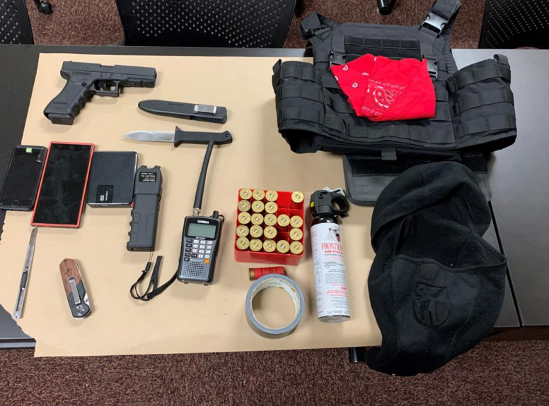 Through a search of his car, officers found ammunition, pepper spray, a stab resistant vest, a stun gun, and a replica Glock handgun, a scanner with the channel set to “police,” along with a black ski mask and duct tape, according to the department.