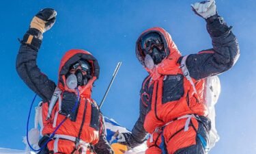 Shayna Unger (left) and Scott Lehmann celebrate their Everest ascent.
