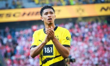 Jude Bellingham applauds the Borussia Dortmund fans after a match.