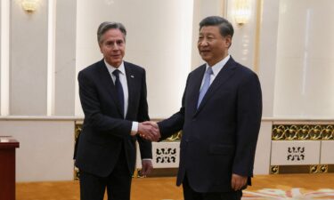 U.S. Secretary of State Antony Blinken walks as he arrives to meet with China's Director of the Office of the Central Foreign Affairs Commission Wang Yi (not pictured) at the Diaoyutai State Guesthouse in Beijing