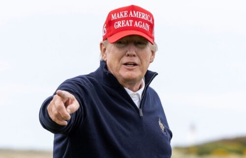 Trump gestures during a round of golf at his Turnberry course on May 2