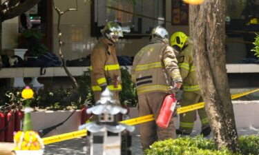 Firefighters investigate an explosion site at a school in Bangkok