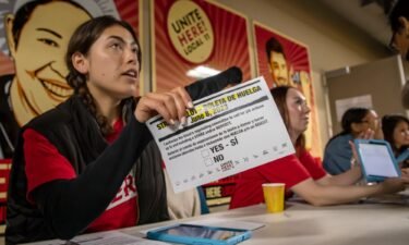 Marissa Langley attends to hotel workers coming for a strike authorization vote at the Unite Here 11 office in Los Angeles on June 8.