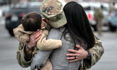 U.S. Army SSG. Tyler Laliberte embraces his family after returning from a 9-month deployment to Afghanistan on December 10