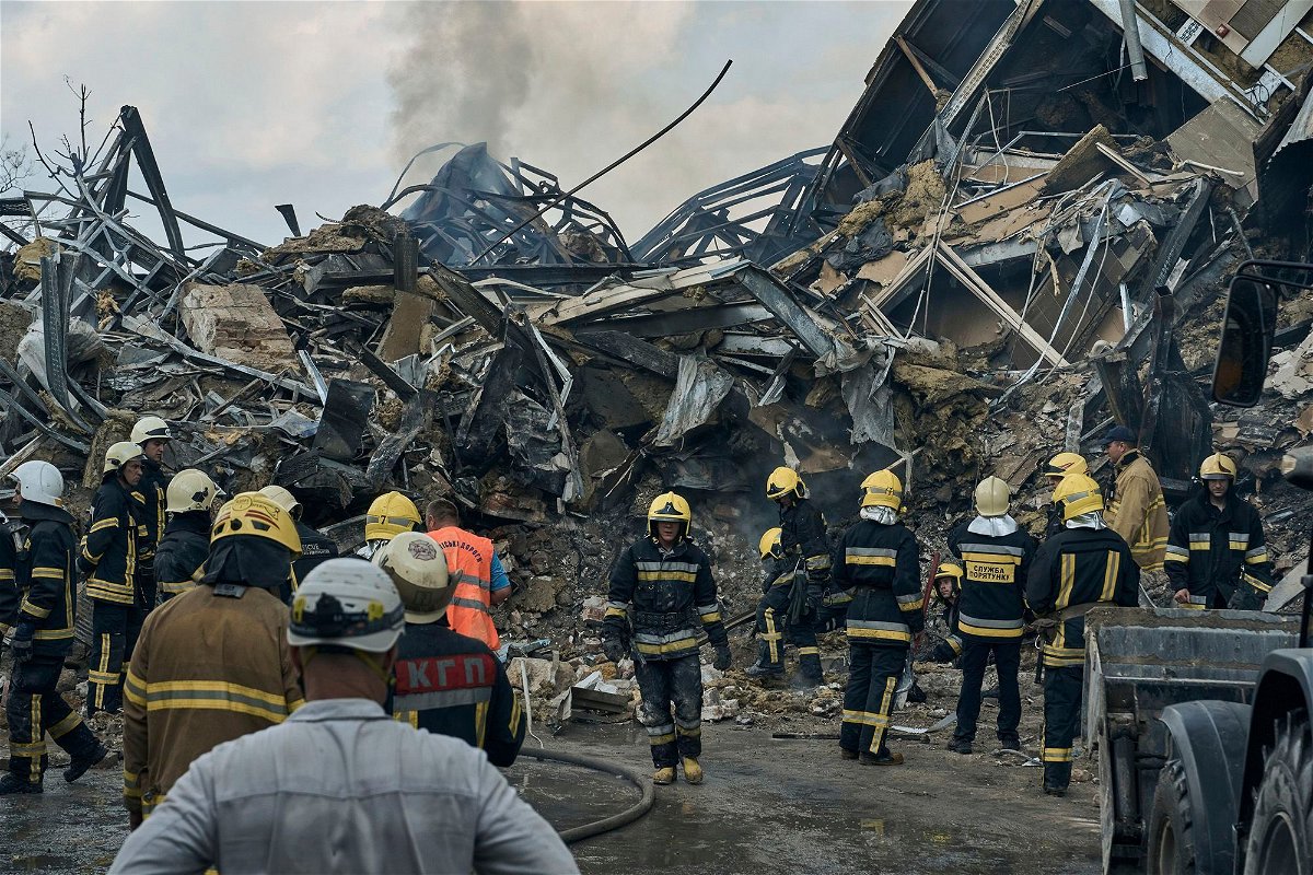 Emergency service personnel work at the site of a destroyed building after a Russian attack in Odesa