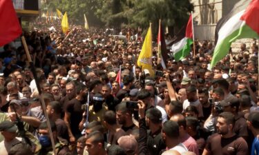 Celebratory gunfire rang out as thousands marched through the streets of Jenin and its camp to join the funeral procession that quickly turned into a demonstration of resistance.