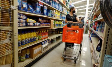 A customer looks over merchandise at a store on March 14 in Miami