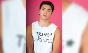 Transgender athlete and advocate Schuyler Bailar of New York City wears a tank that says "trans is beautiful" in 2017.