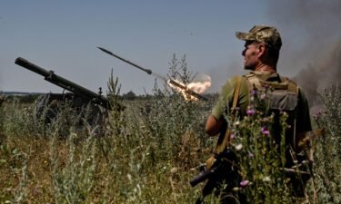 Ukrainian servicemen fire a Partyzan small multiple rocket launch system toward Russian troops near a front line.