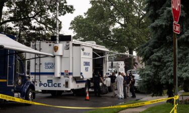 Crime laboratory officers are seen outside Rex Heuermann's home in Massapequa Park on July 18.