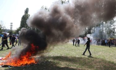 Far-right demonstrators broke through the police cordon and started a fire.