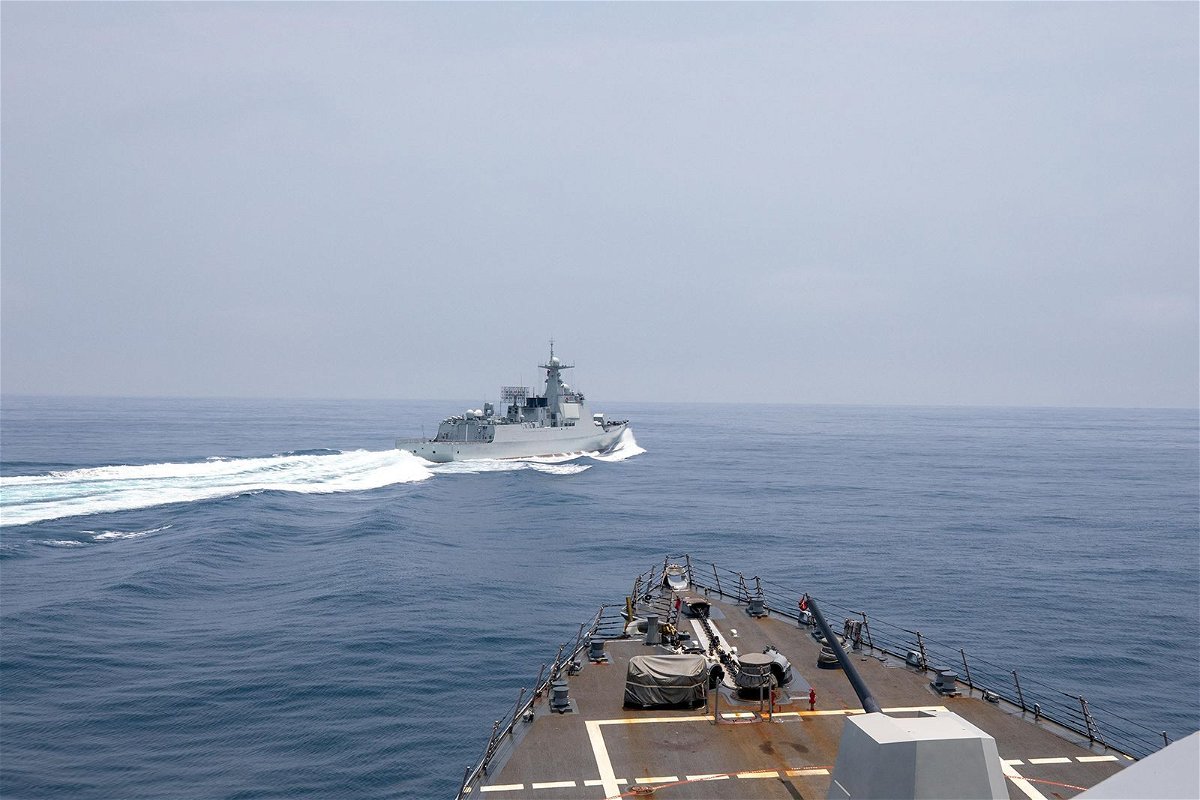 The Chinese warship Luyang III sails near the American destroyer USS Chung-Hoon
