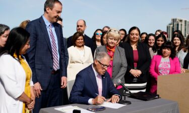 Washington Gov. Jay Inslee prepares to sign House Bill 1340