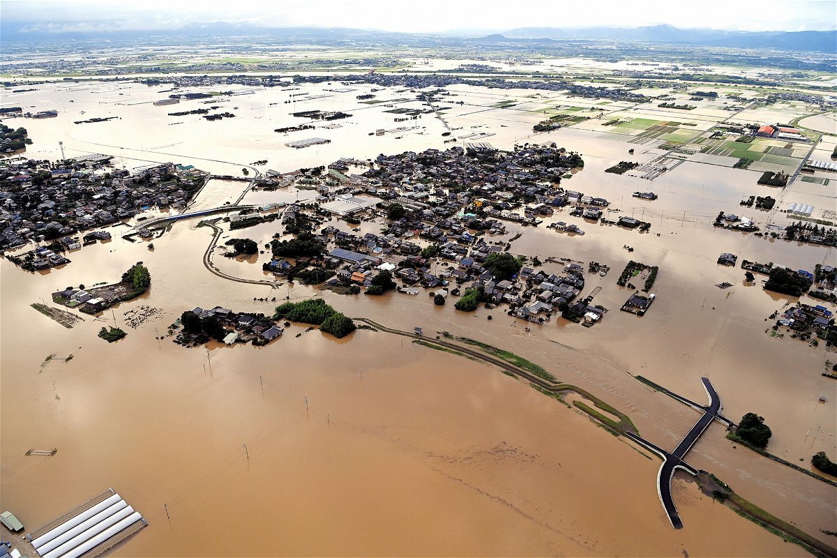 Ohashi Elementary School and the surrounding area are inundated after the Kosegawa River flooded following torrential rain on July 10