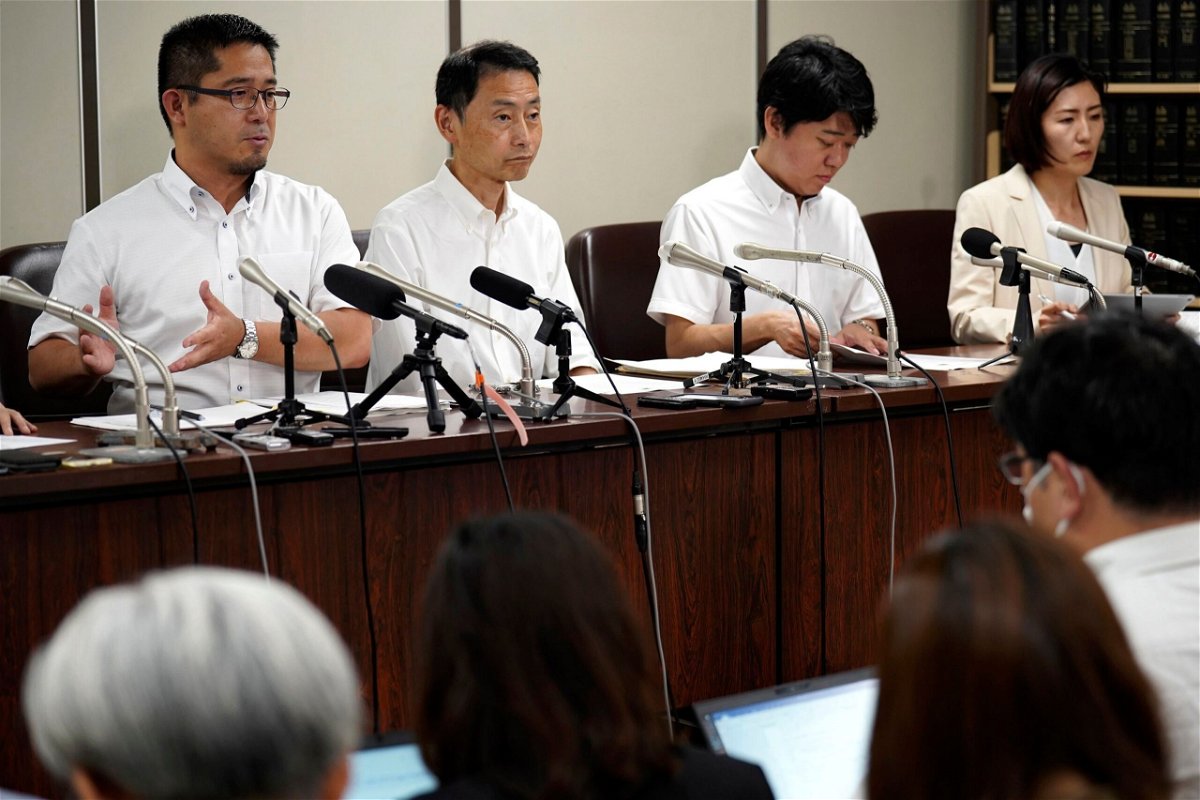 Lawyers speak during a news conference at Tokyo District Court on July 11