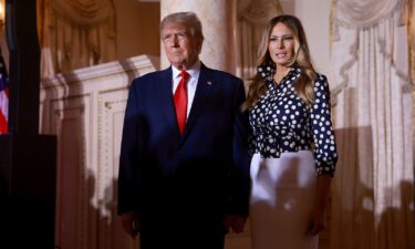 Former President Donald Trump and former first lady Melania Trump arrive for an event at Mar-a-Lago on November 15