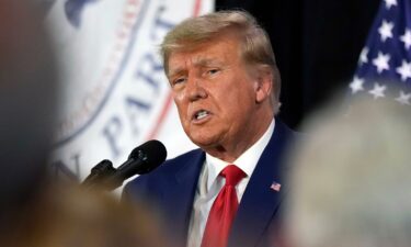 Former President Donald Trump visits with campaign volunteers at the Elks Lodge on July 18 in Cedar Rapids