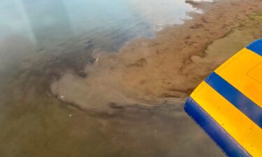 This photo provided by North Slope Borough shows an aerial view of a shallow lake where helicopter debris was found on Alaska's North Slope near Utqiagvik