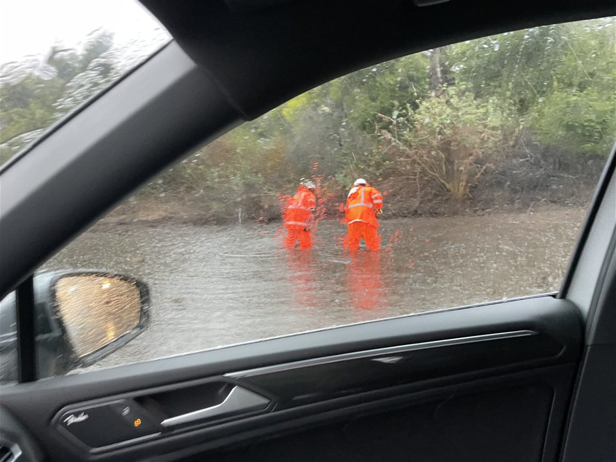 Roadwork during flooding on the side of northbound Highway 101 near Olive Mill on Thursday morning.