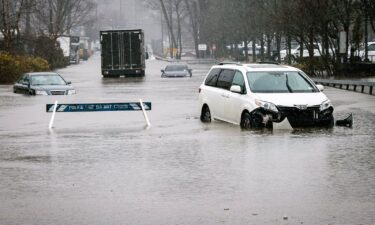 Cars are submerged in flood water in Elmsford