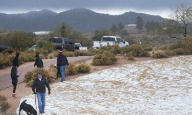 Snow and hail accumulate on the ground in Scottsdale