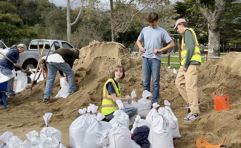 Volunteers help with sand bagging in Montecito