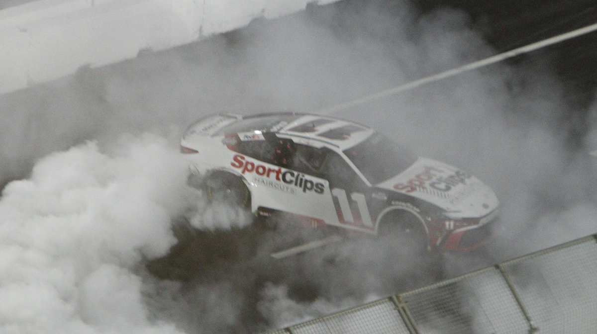 Denny Hamlin celebrates his win at the Busch Light CLASH in the Los Angeles Memorial Coliseum with a blinding burnout.