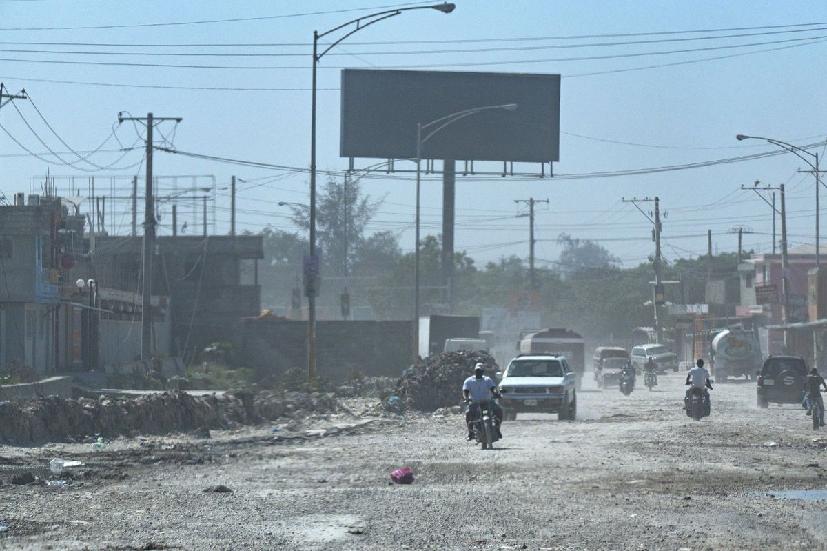 Vigilantes battle gangs in port au prince as haiti s elites vie for