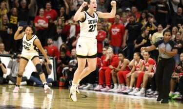 Iowa guard Caitlin Clark broke the scoring record with a pair of free throws at the end of the first half.
