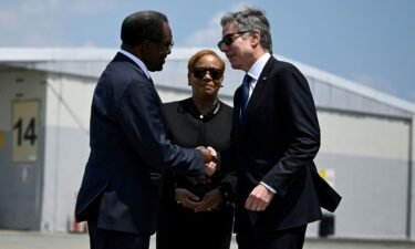 US Secretary of State Antony Blinken is greeted by US Ambassador to Jamaica