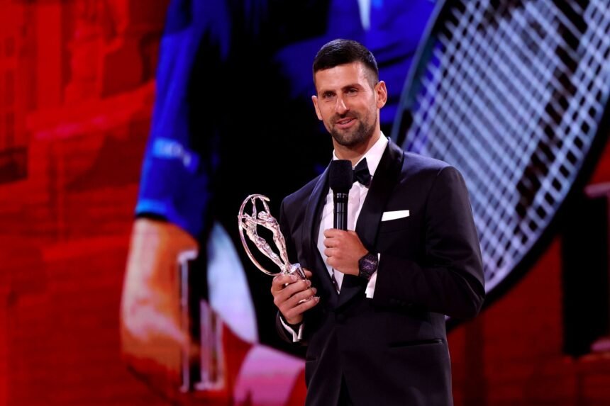 Novak Djokovic accepts the Laureus World Sportsman of the Year award on stage during a ceremony in Madrid