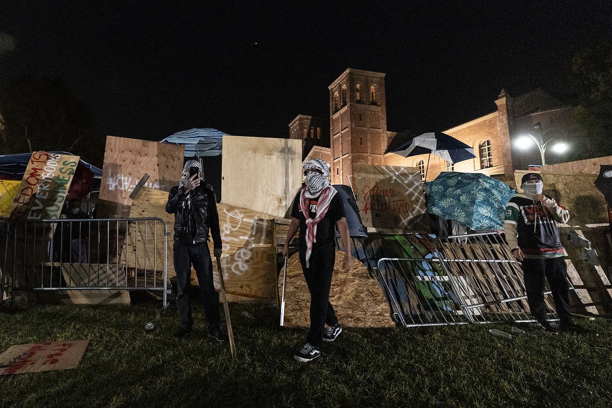 Counter protesters attack a pro-Palestinian encampment set up on the campus of the University of California Los Angeles (UCLA) as clashes erupt