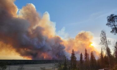 Smoke rises from a wildfire burning near Fort Nelson on May 14.